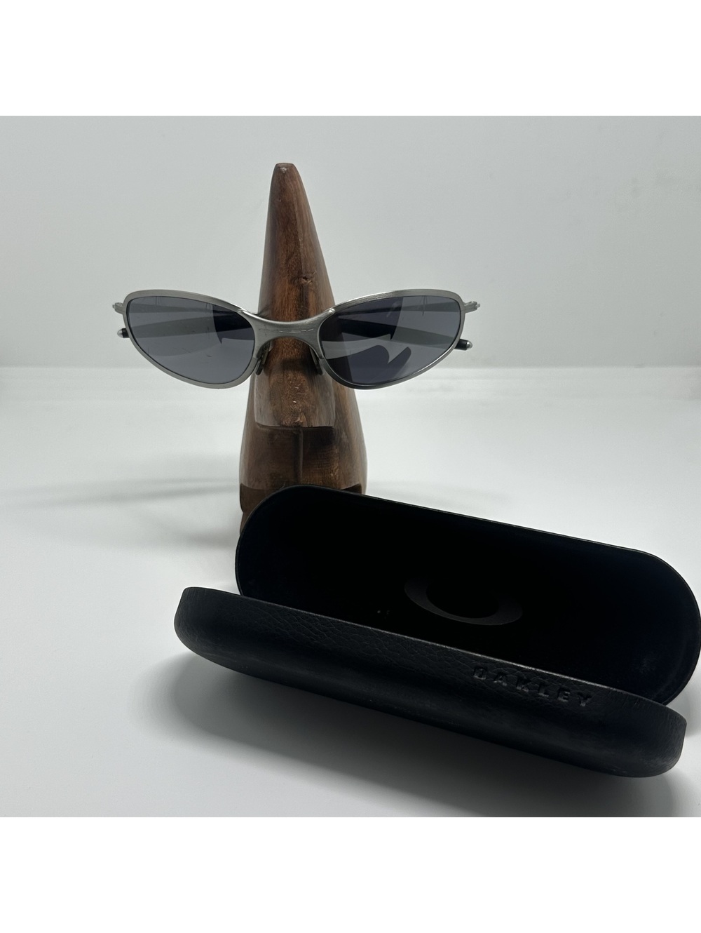 Oakley Silver Metal Frame Sunglasses with Dark Lenses